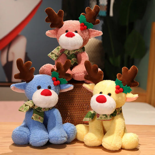 Three colorful plush reindeer toys with Christmas decorations on a wooden surface.