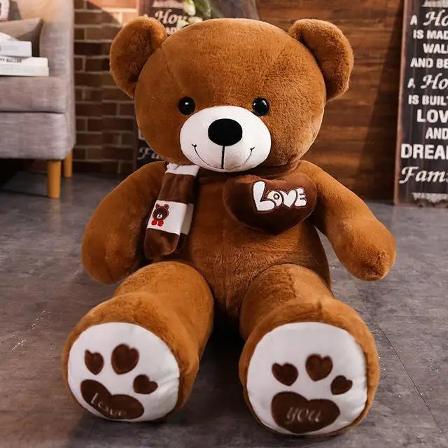 Brown teddy bear with a 'Love' heart and paw prints in a room setting