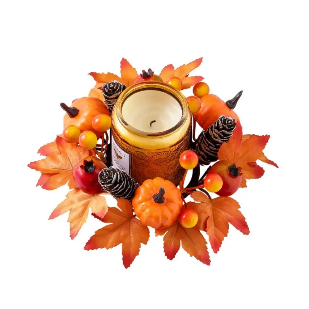 Decorative candle holder with autumn elements on a white background