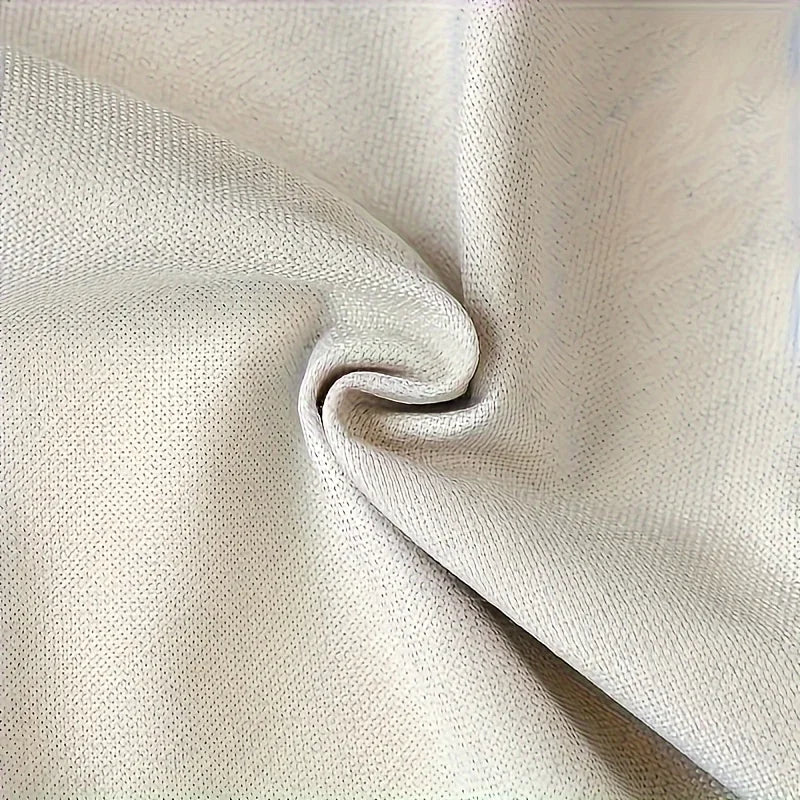 Close-up of beige fabric with a slight texture