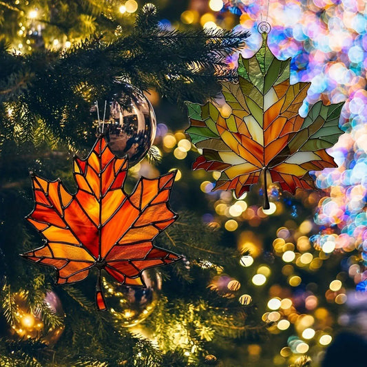 Stained acrylic ornaments on a Christmas tree with blurred lights in the background
