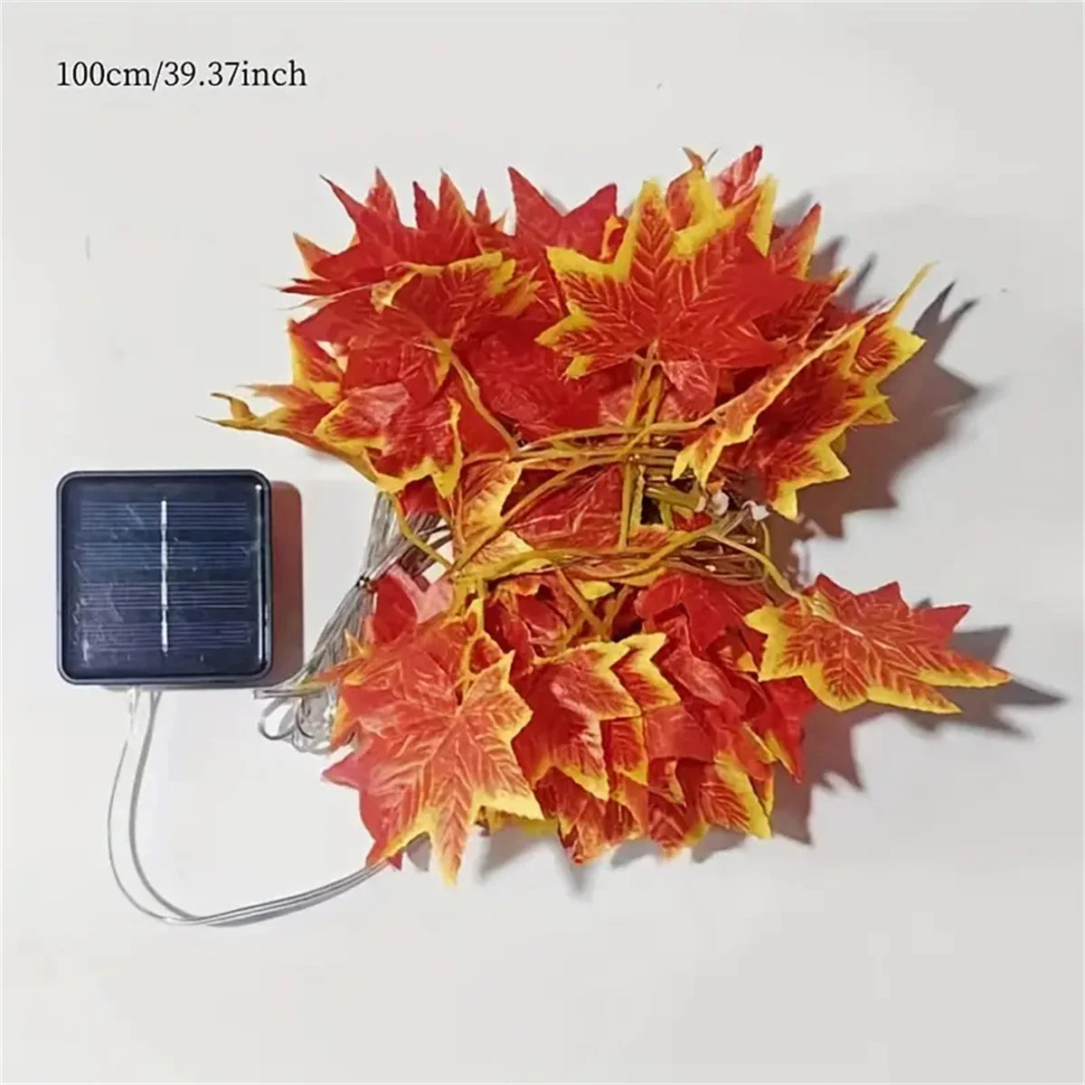 String of red and yellow leaf lights with a solar panel on a white background