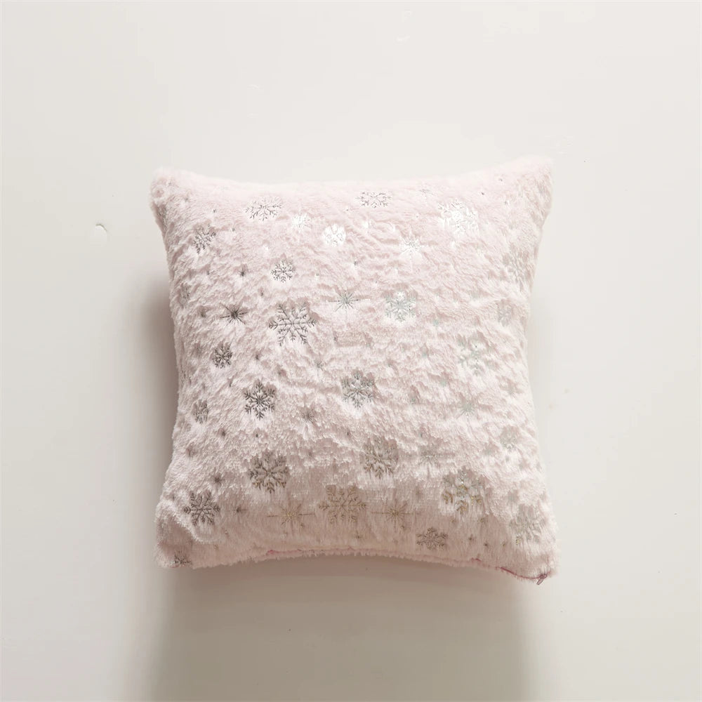 Snowflake patterned pillow on a light background