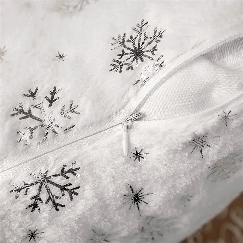 White fabric with black snowflake patterns and a zipper.