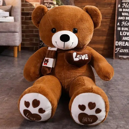 Brown teddy bear with a 'Love' heart and paw prints in a room setting