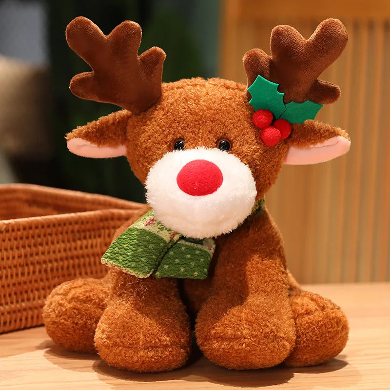 Plush reindeer toy with a holly leaf and berries on a wooden surface.