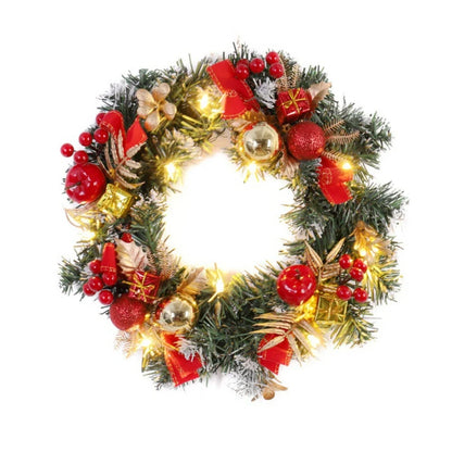 Decorative Christmas wreath with lights, red berries, and ornaments on a white background
