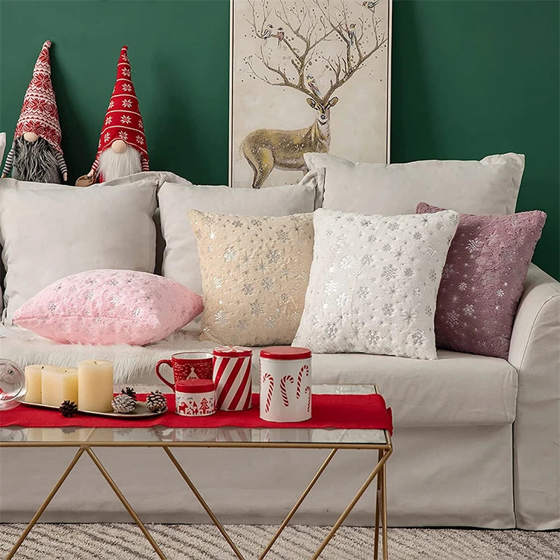 Decorative living room with Christmas-themed pillows and decor