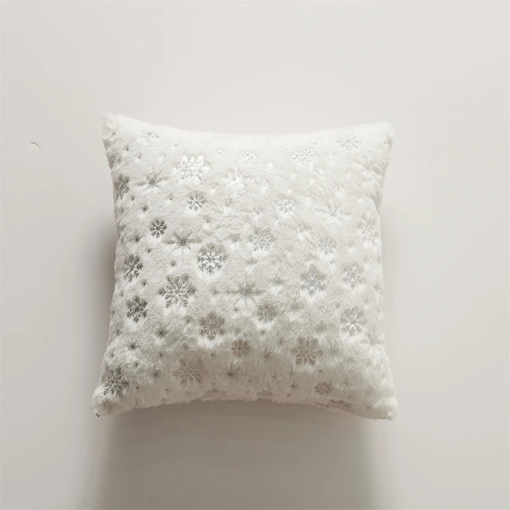 Decorative pillow with snowflake pattern on a white background