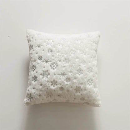 Decorative pillow with snowflake pattern on a white background