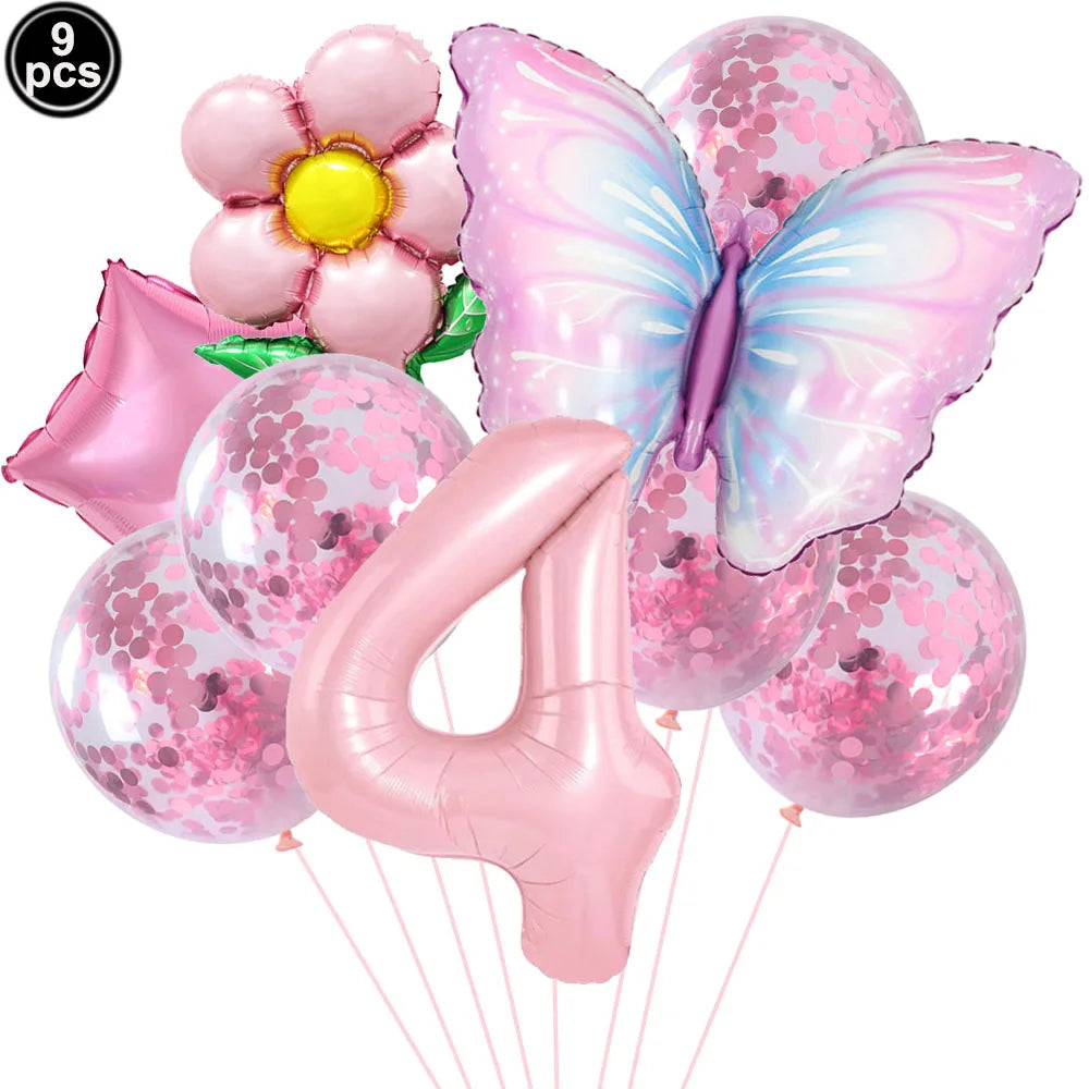 Set of pink balloons including a butterfly, number 4, and flower design on a white background.