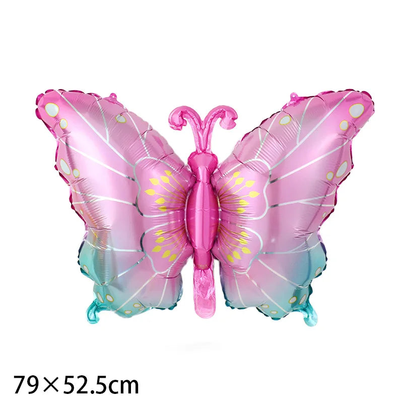 Pink butterfly-shaped balloon with size label '79x52.5cm' on a white background