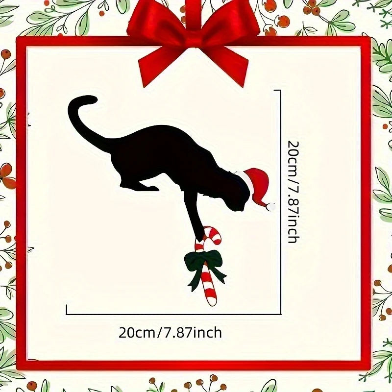 Black cat silhouette with Christmas decorations on a decorative card with a red bow.