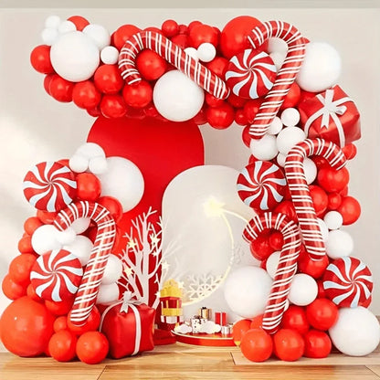 Decorative balloon arch with red, white, and candy cane designs on a neutral background.