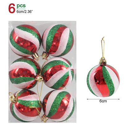 Set of six red, green, and white striped Christmas ornaments with gold hooks on a white background.