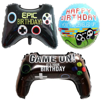 Three inflatable balloons shaped like game controllers with birthday messages on a white background.