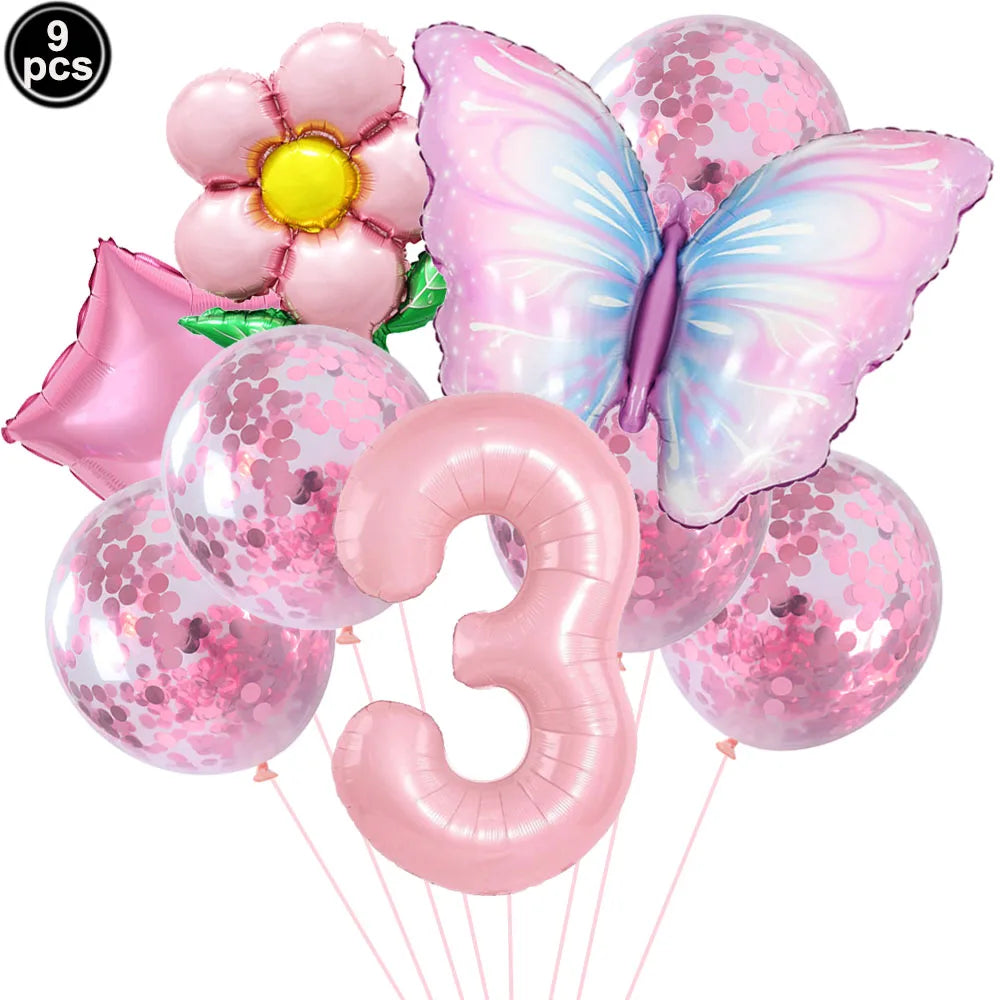Set of pink balloons including a butterfly, number 3, and flower design on a white background.