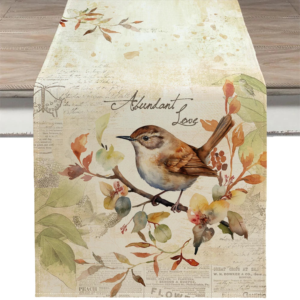 Decorative table runner with a bird and floral design on a wooden surface