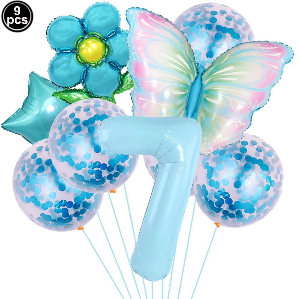 Set of colorful balloons including a butterfly, flower, and confetti balloons with a blue handle.
