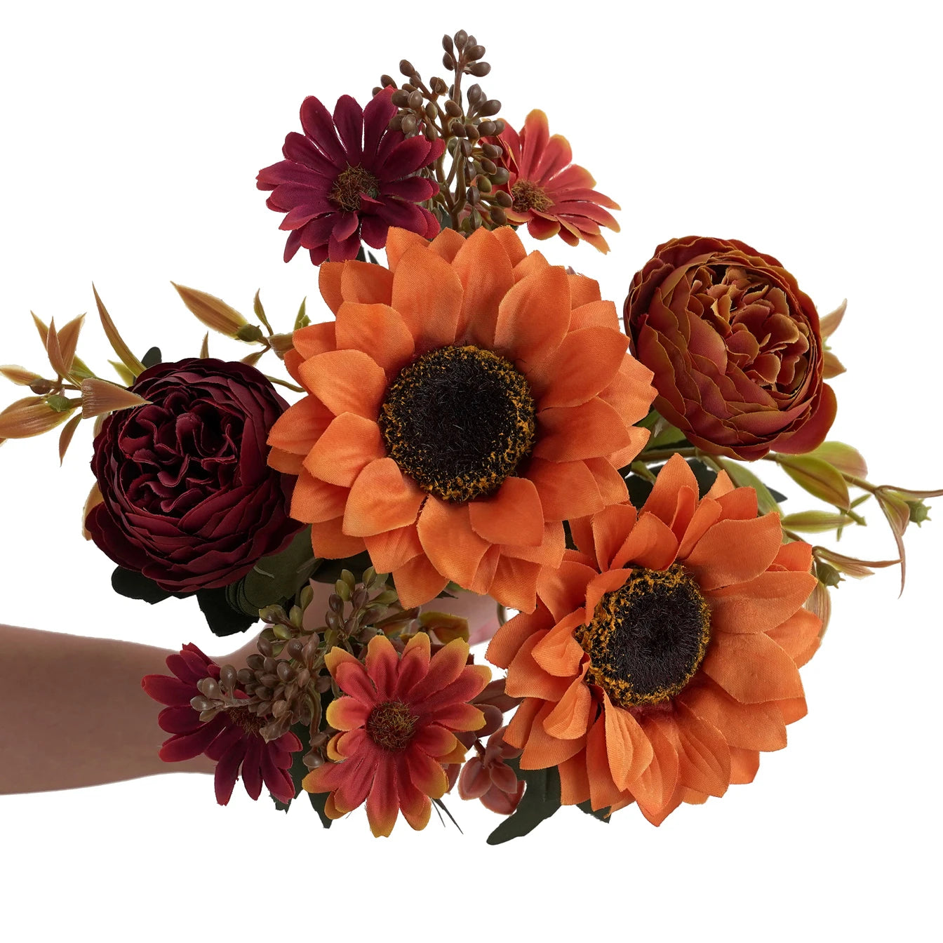 Bouquet of orange and red flowers held by a person on a white background
