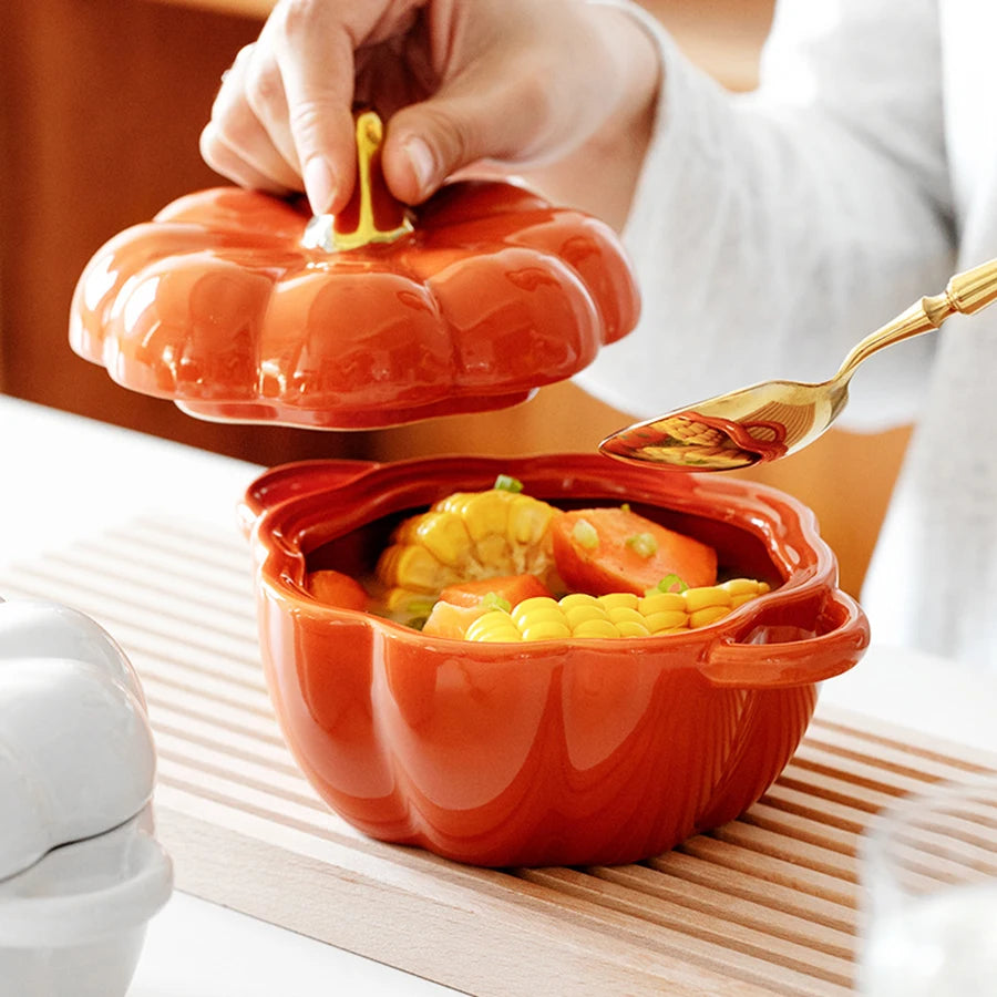 Pumpkin-shaped bowl with food being served using a spoon