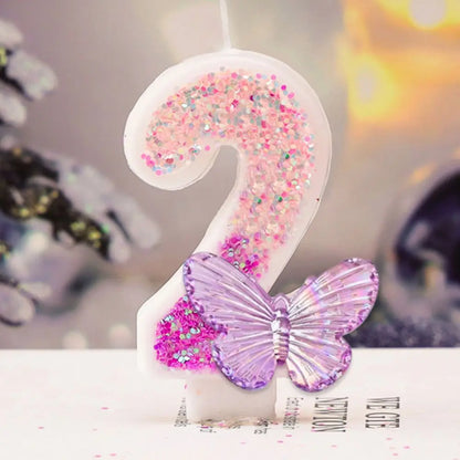 Decorative number '2' with pink glitter and a purple butterfly on a blurred background