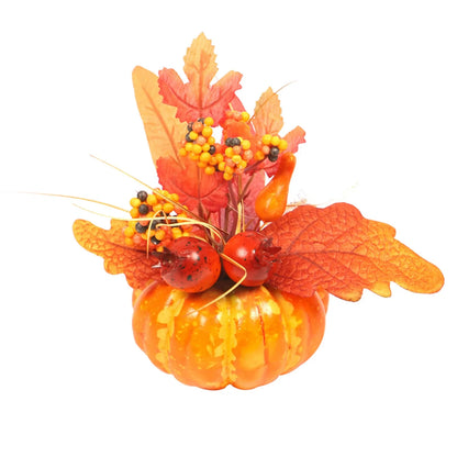 Decorative pumpkin with autumn leaves and berries on a white background