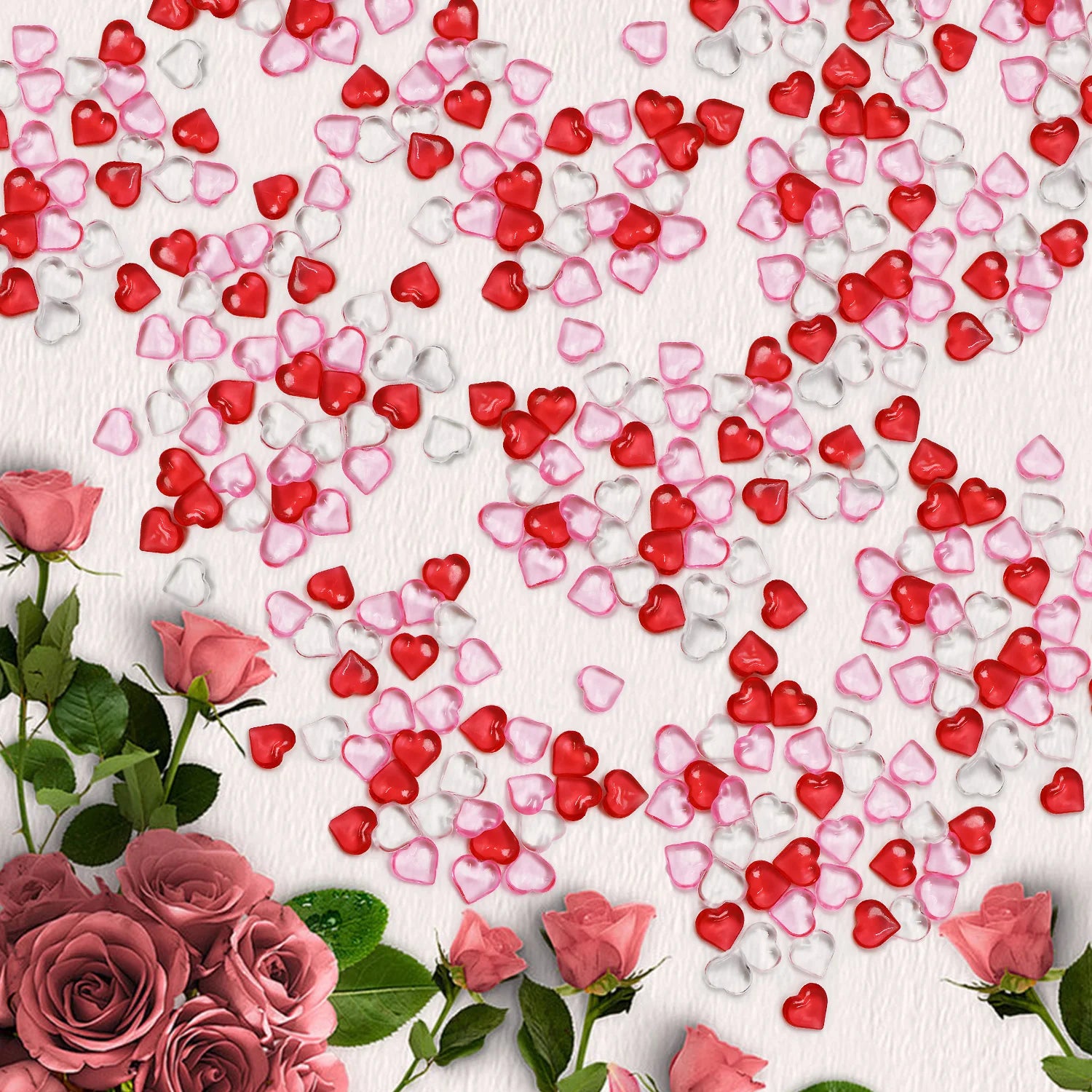 Heart-shaped confetti in red, pink, and white on a white background with pink roses.