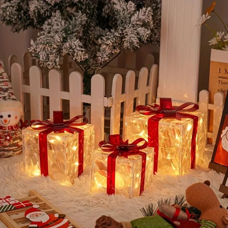 Decorative Christmas lights shaped like presents with red ribbons on a festive background.