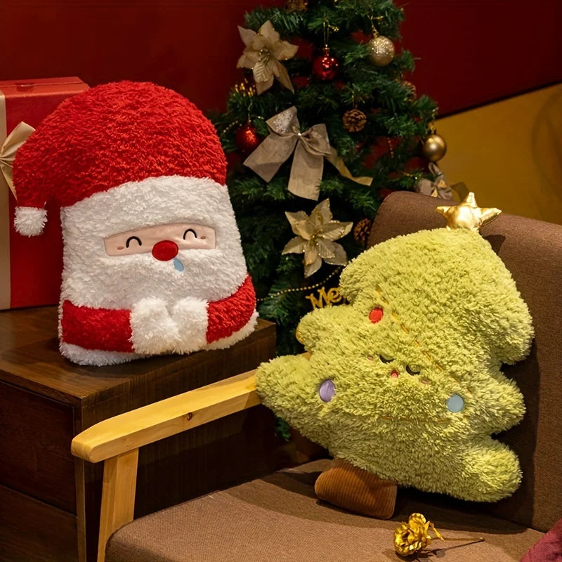 Plush toys resembling Santa Claus and a Christmas tree in front of a decorated tree.