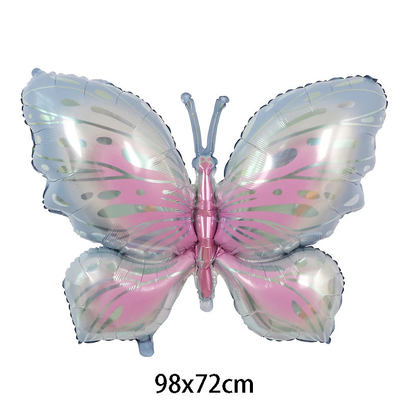 Butterfly-shaped balloon with pink and silver design on a white background