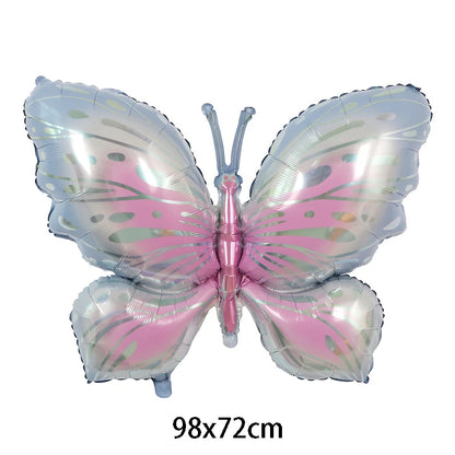 Butterfly-shaped balloon with pink and silver design on a white background