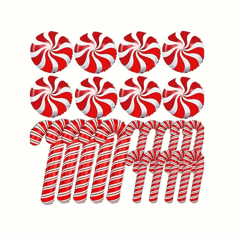 Red and white striped candy canes and peppermints on a white background