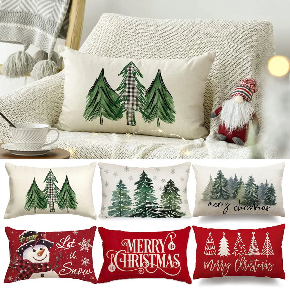 Collection of Christmas-themed pillows with trees, snowmen, and text on a couch.