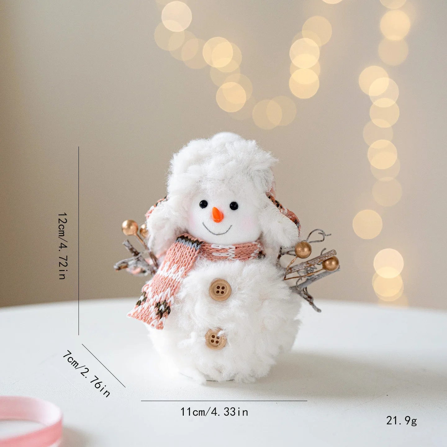 Decorative snowman figure with measurements and weight on a blurred background