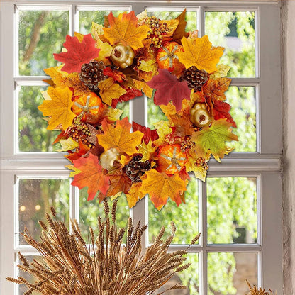 Autumn wreath with colorful leaves and pinecones on a window background