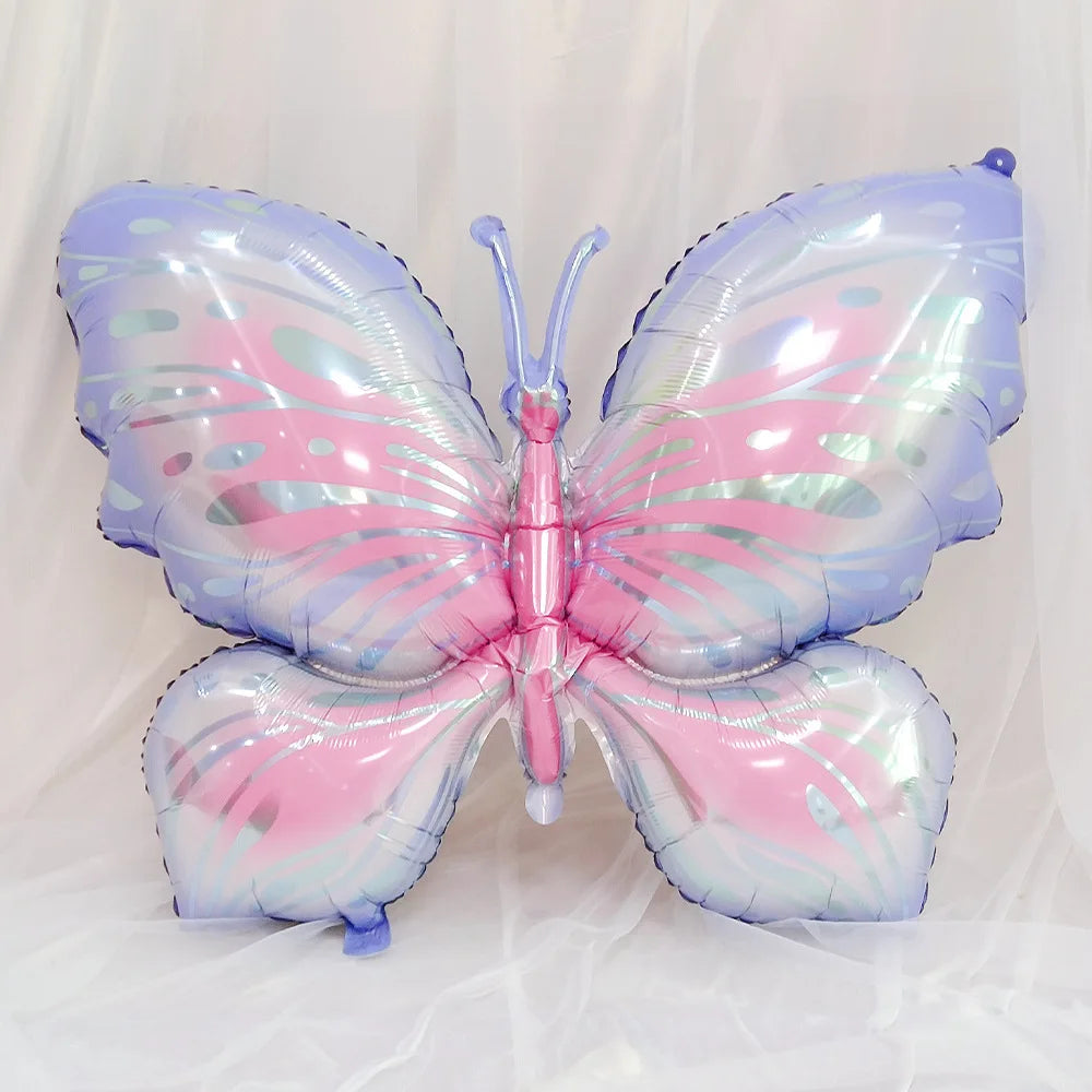 Butterfly-shaped balloon with pastel colors on a light background