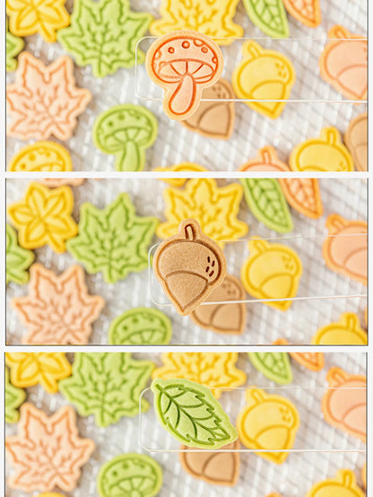 Set of autumn-themed cookie cutters on a white background