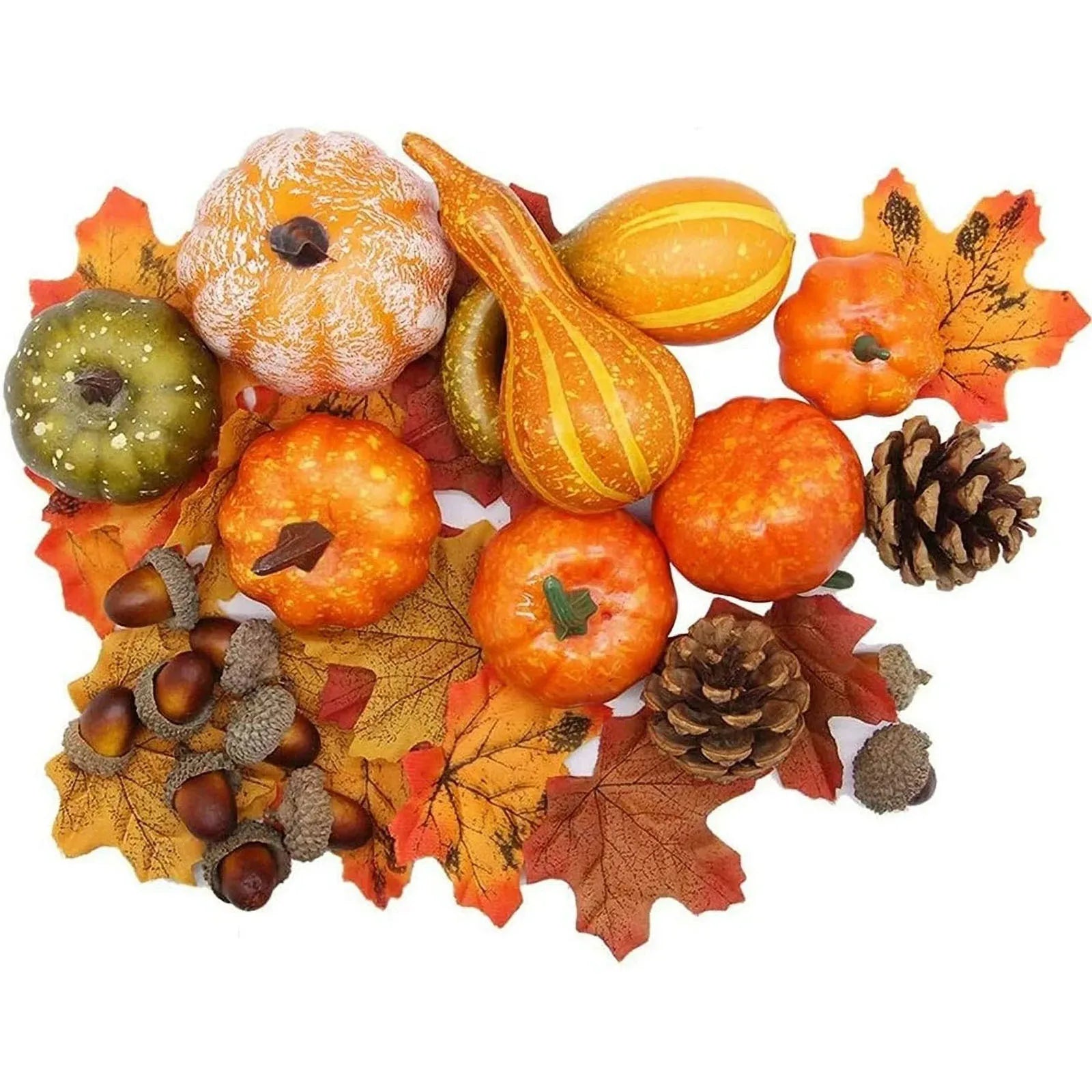 Decorative arrangement of pumpkins, gourds, and fall leaves on a white background