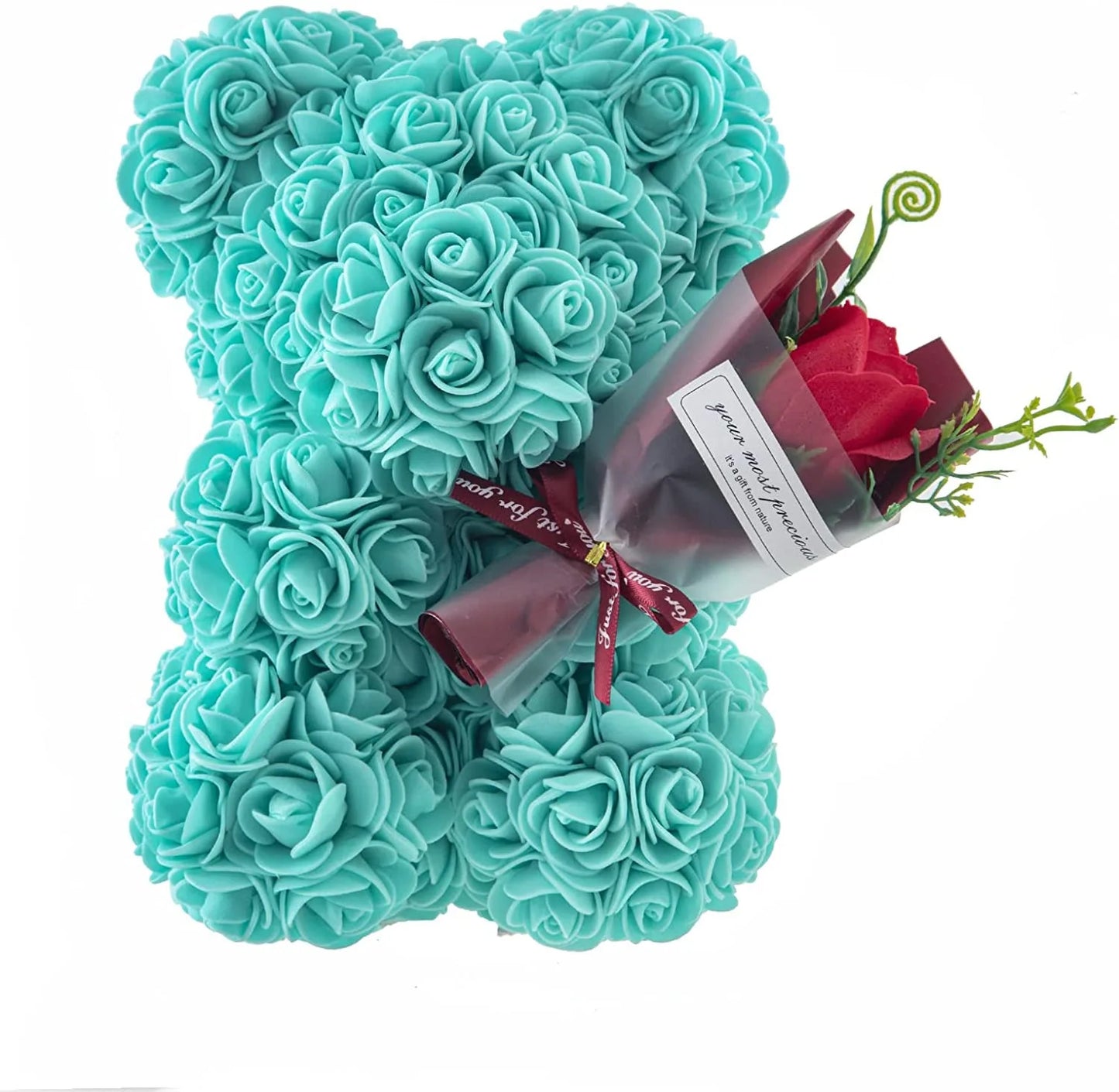 Turquoise rose teddy bear with a bouquet of red roses on a white background