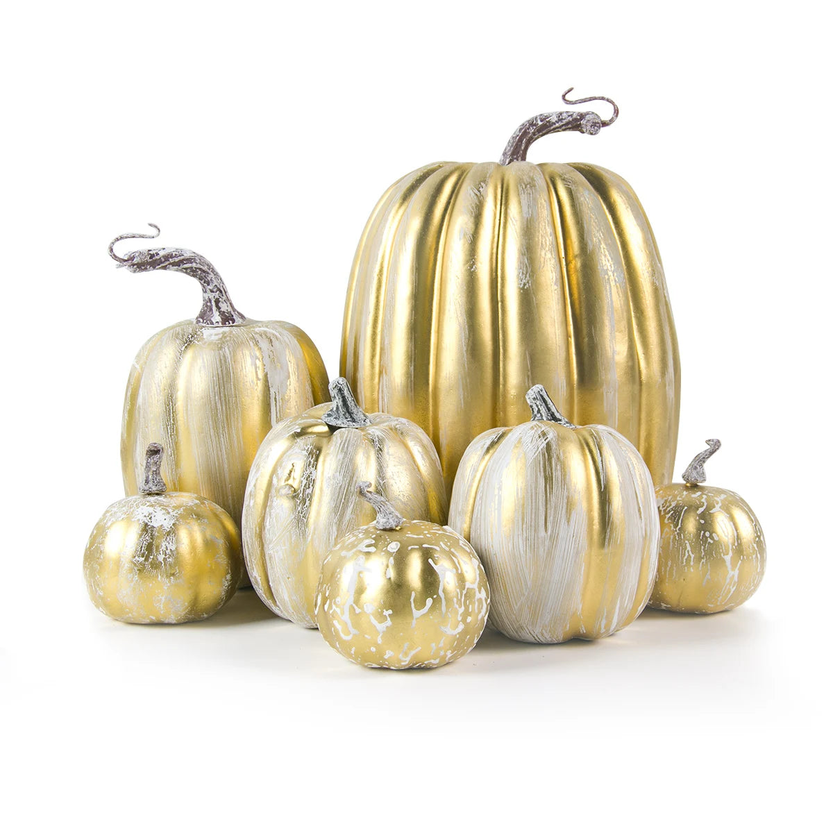 Decorative gold and silver pumpkins on a white background