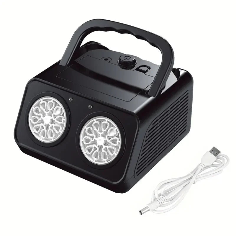 Black fog machine with two circular lights and a USB cable on a white background