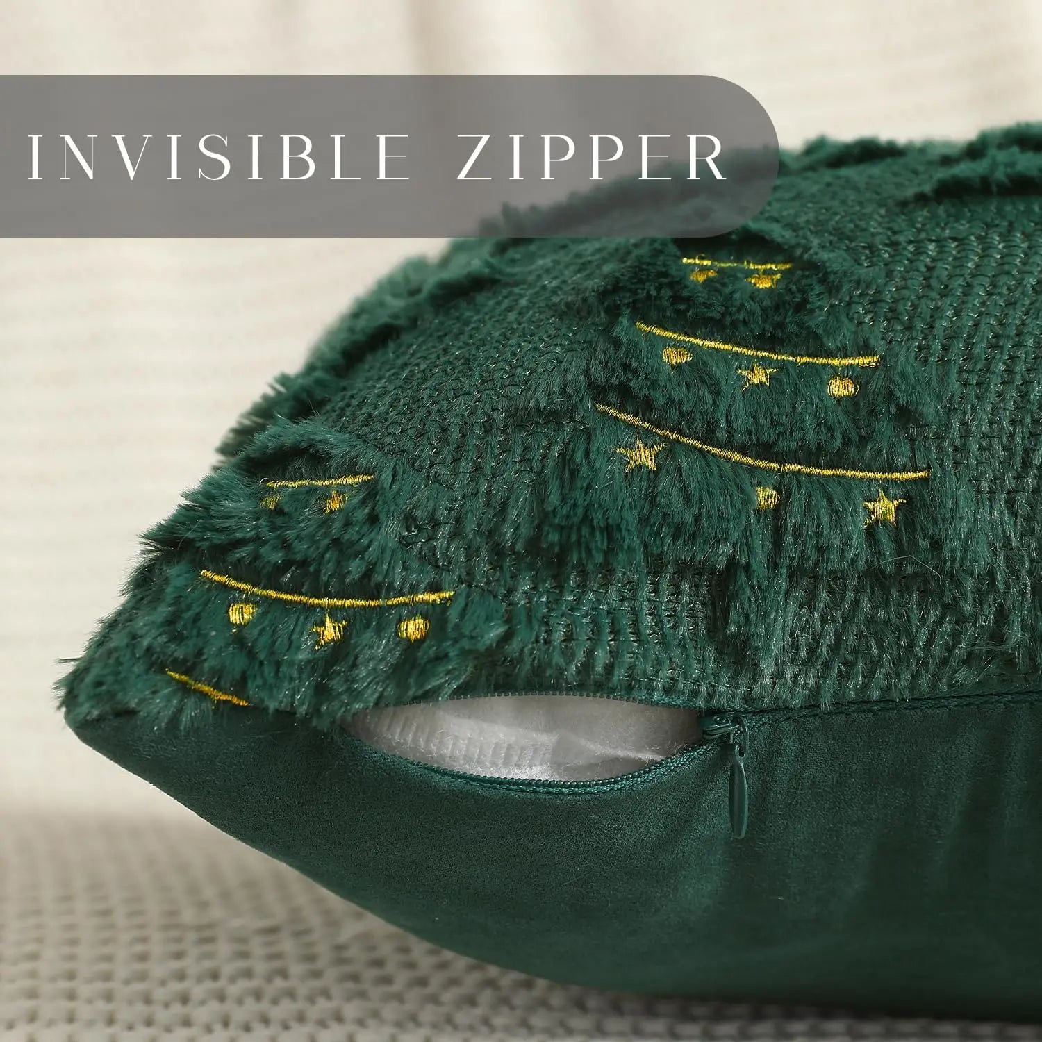 Green fabric with an invisible zipper and gold embroidery on a neutral background