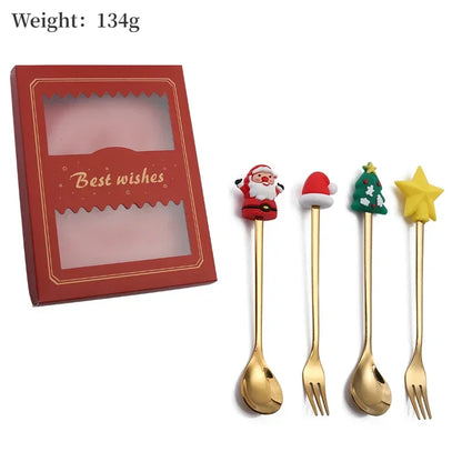 Set of Christmas-themed spoons and forks with decorative ends in front of a red box labeled 'Best wishes'.