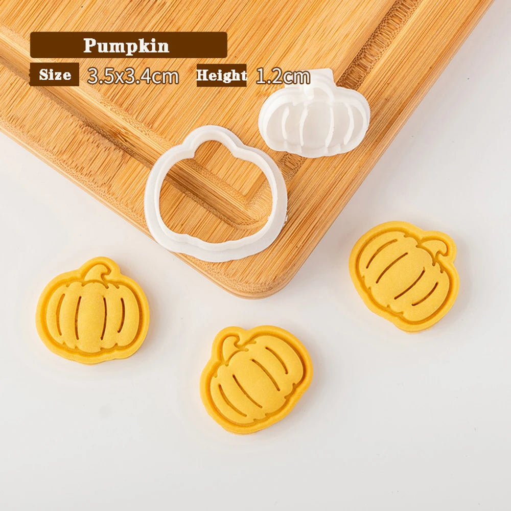Pumpkin-shaped cookie cutters on a wooden board with measurements displayed.