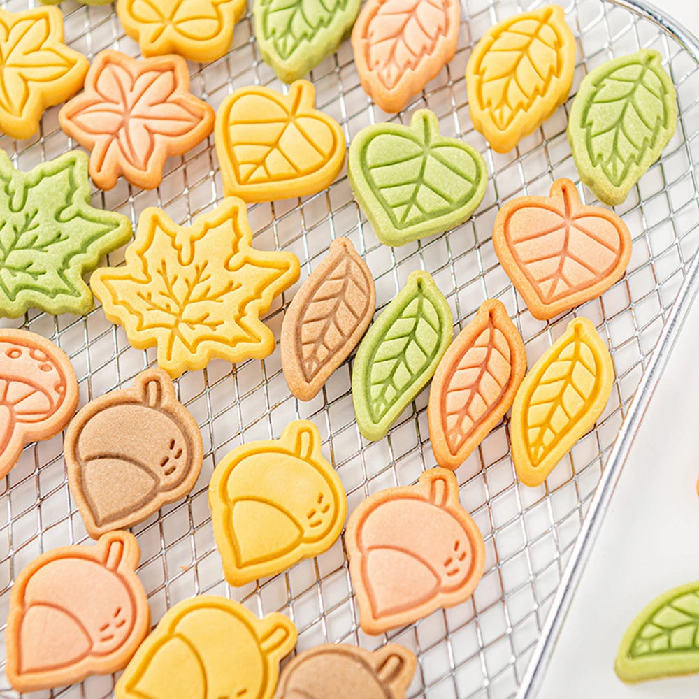 Colorful leaf-shaped cookies on a cooling rack