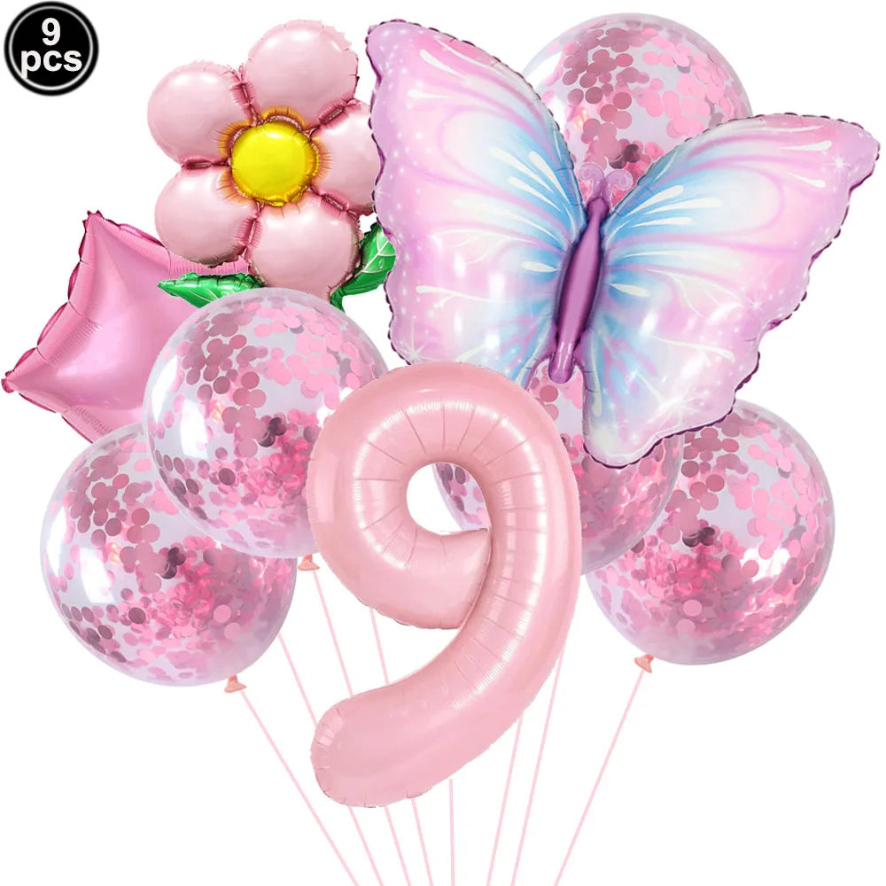 Set of pink balloons including a butterfly, flower, and number 9 on a white background