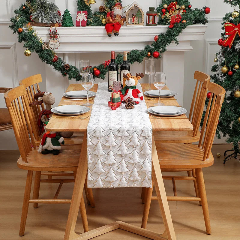 Dining room with a Christmas-themed table setting, decorations, and tree.