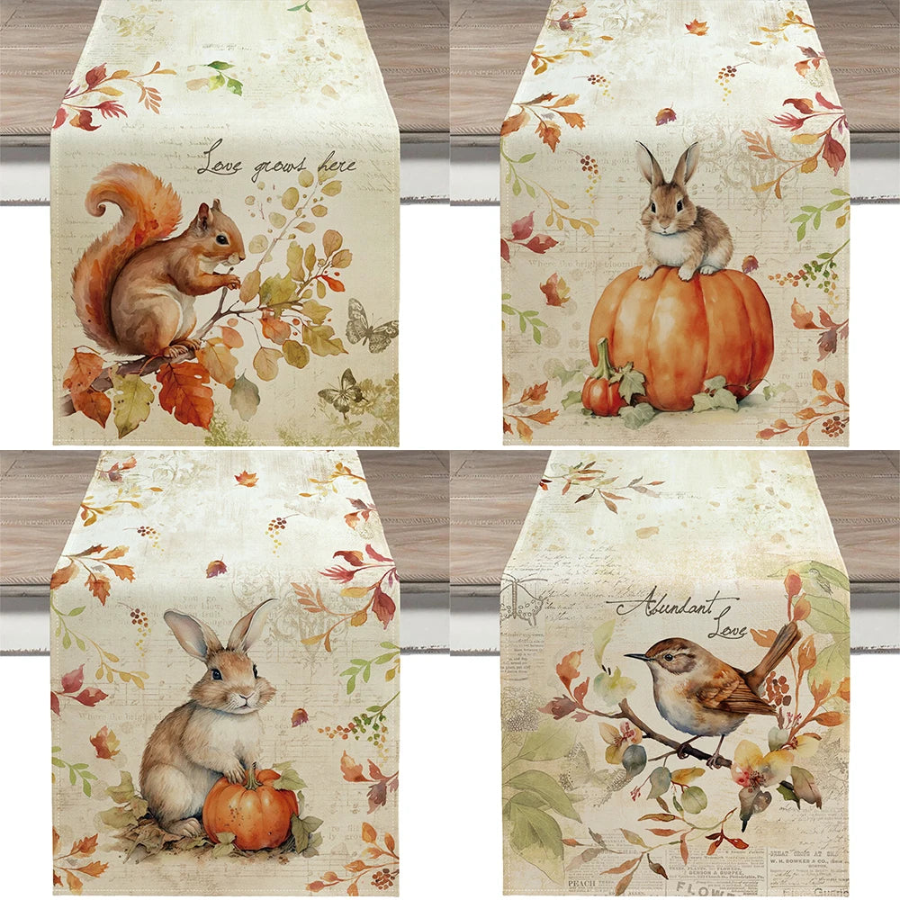 Set of four autumn-themed table runners with animals and leaves on a wooden surface.