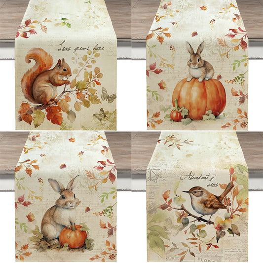 Set of four autumn-themed table runners with animals and leaves on a wooden surface.